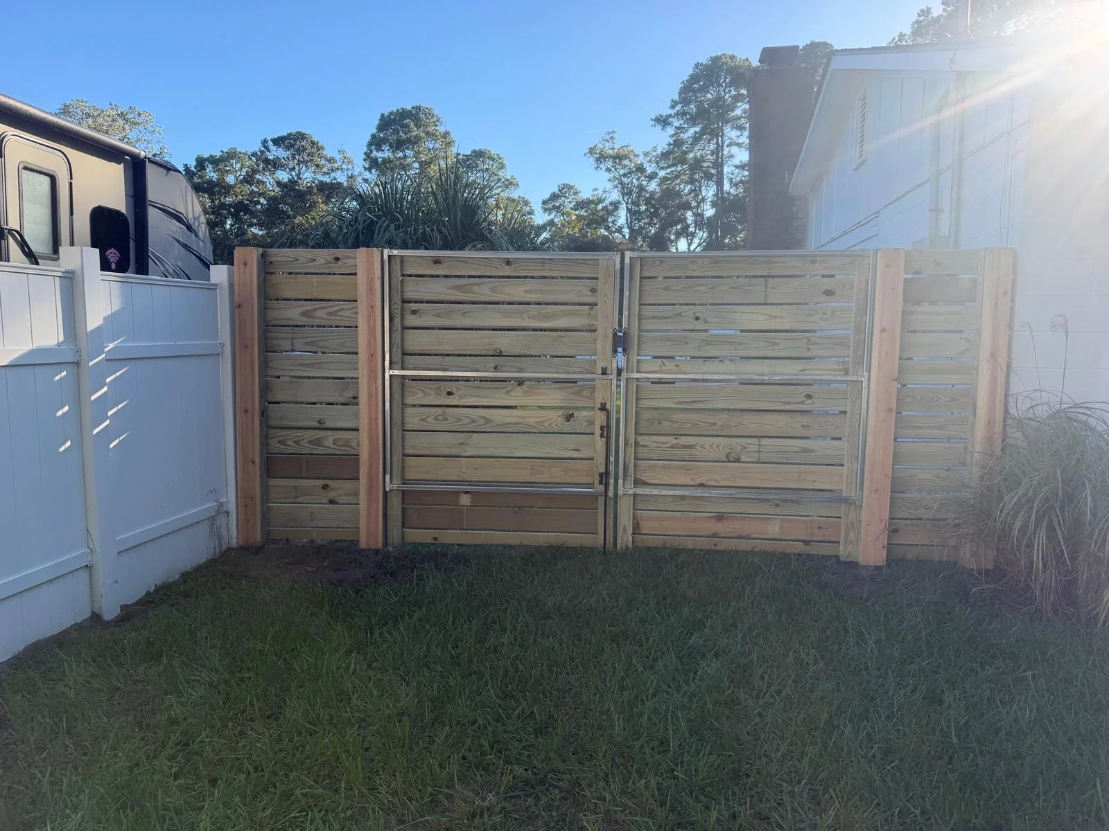 Custom horizontal wood double gate with metal frame