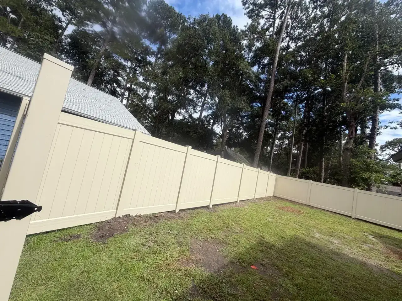 Tan vinyl privacy fence