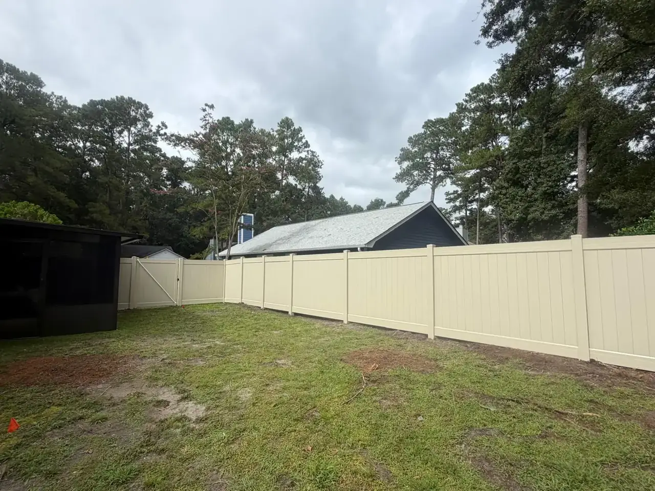 Tan vinyl privacy fence