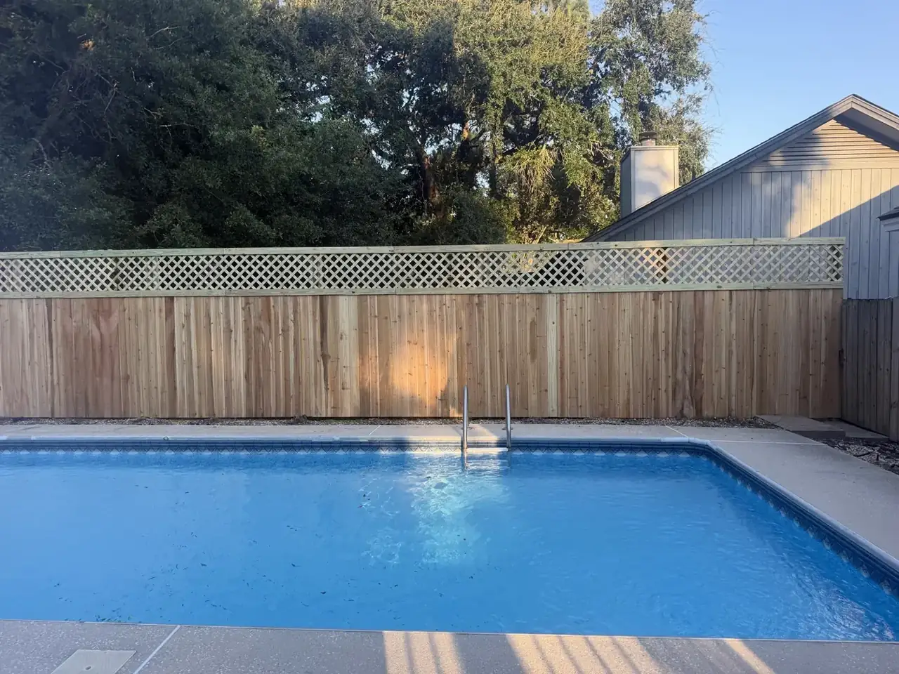 Poolside wood fence with lattice