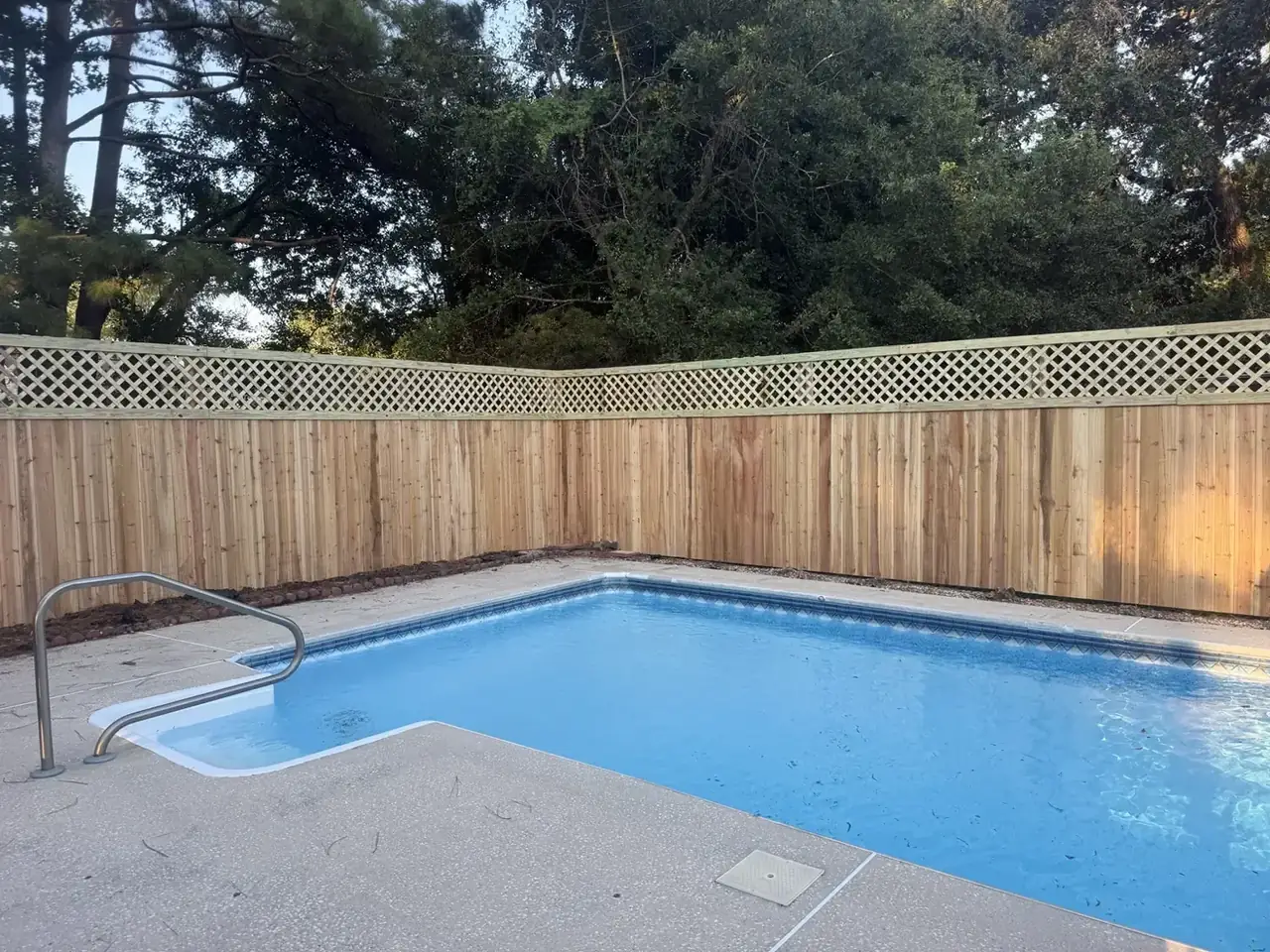 Poolside wood fence with lattice