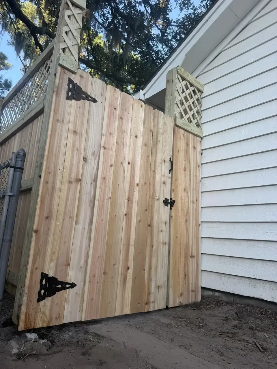 Wood gate with lattice-top fence