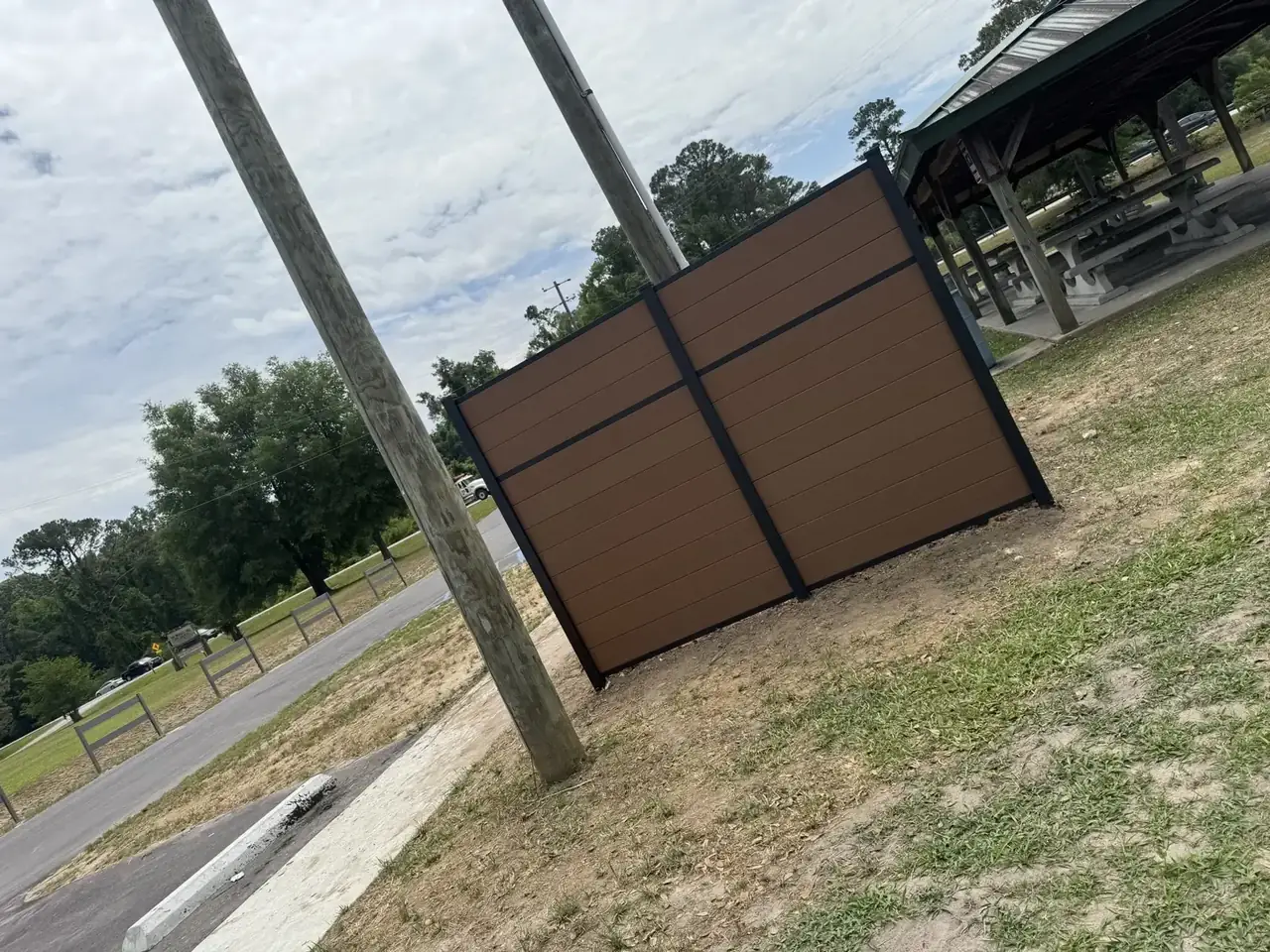 Greenwood Fence Systems — Brown privacy enclosure