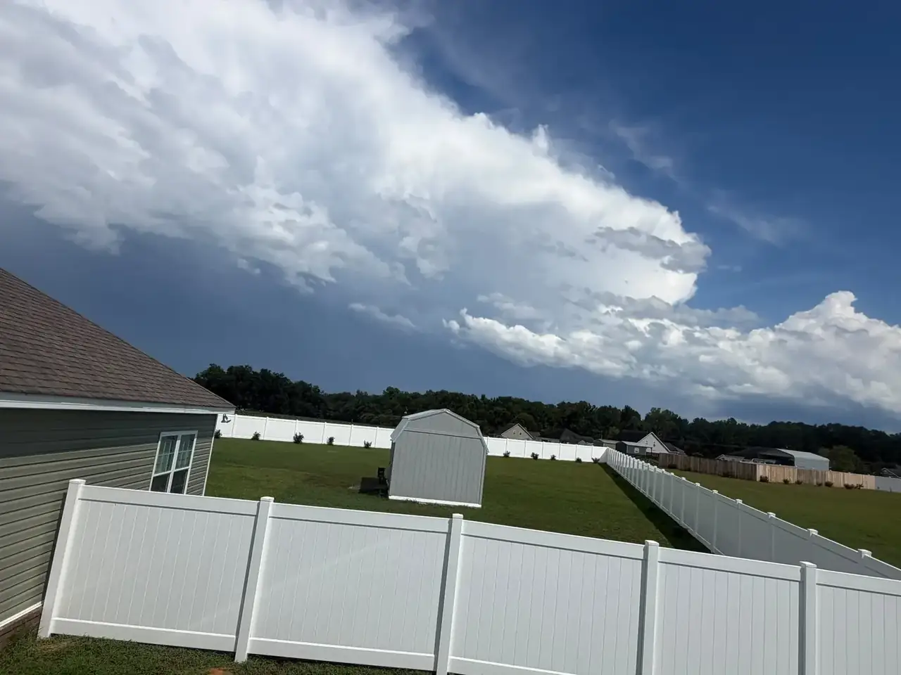 White vinyl backyard fence
